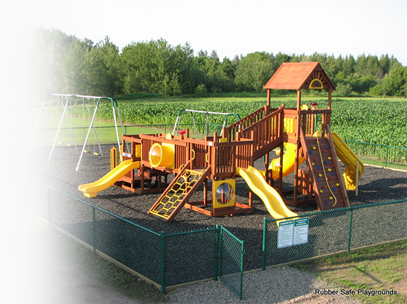A playground with a rubber mulch surface