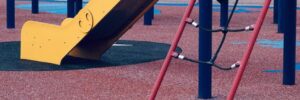 A playground with a rubber mulch surface