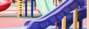 A playground with a rubber mulch surface